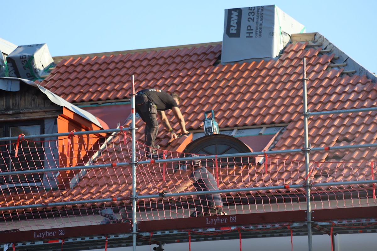 Roofer at work on a residential roof